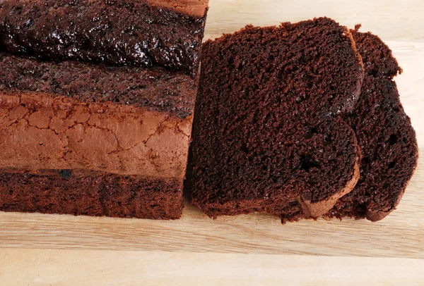 Top view belgium chocolate cake loaf focus on slice — Stock Photo, Image