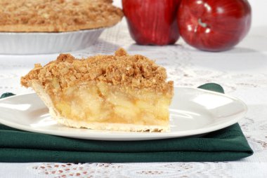 Apple crumble with pie in the background clipart