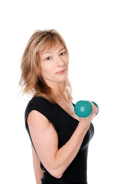 Older woman holding a dumbbell — Stock Photo, Image