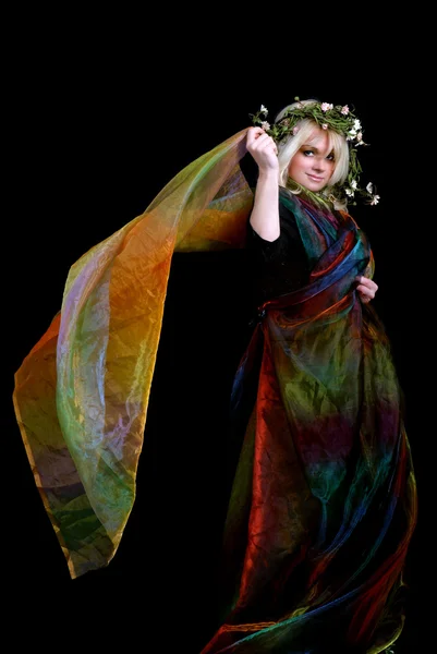 Older woman dancing using colorful silk fabric — Stock Photo, Image
