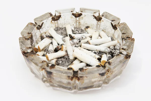 A lot of smoke ashtray on a white backgr Stock Photo