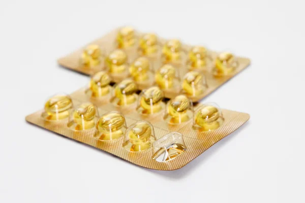 stock image Fish oil capsules on a white background