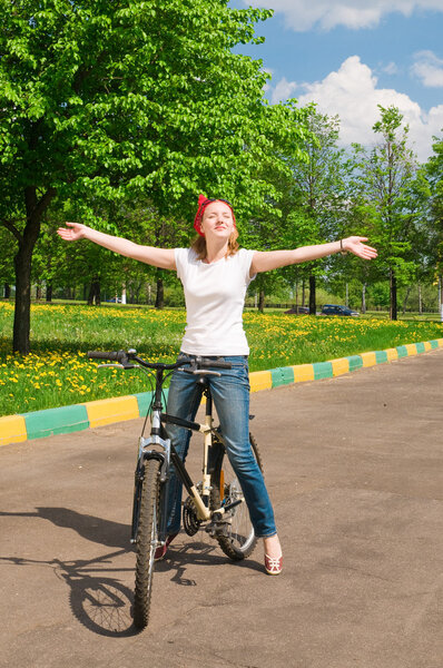 Shoot of young woman with bicycle