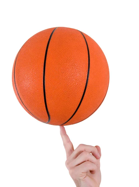 LIsolated basketball ball on a human finger Stock Picture