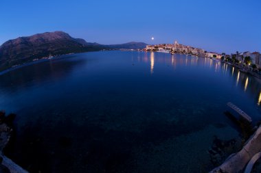 Moonrise over Korcula clipart