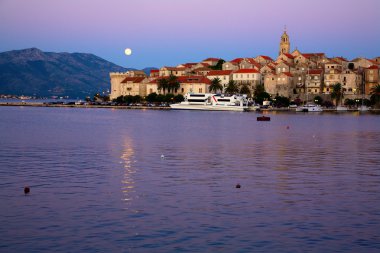 Moonrise over Korcula clipart