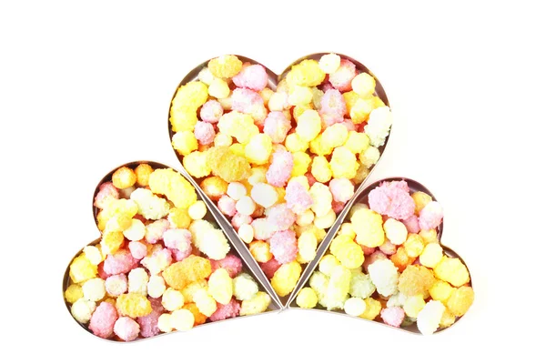 Trois cœurs remplis de bonbons — Photo