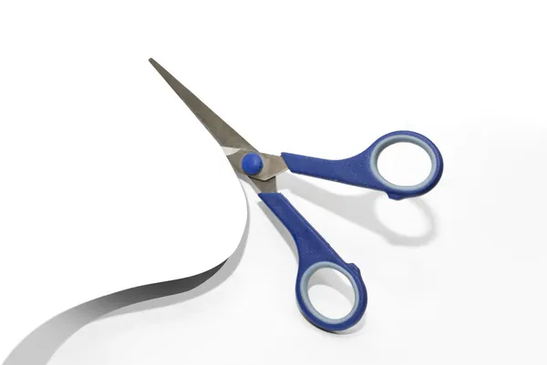 Scissors cutting a paper — Stock Photo, Image