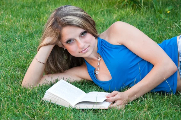 stock image Beautiful girl reads the book