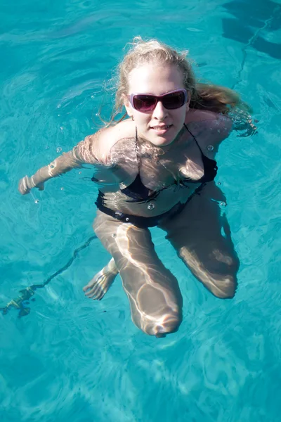 stock image Girl swims in the sea