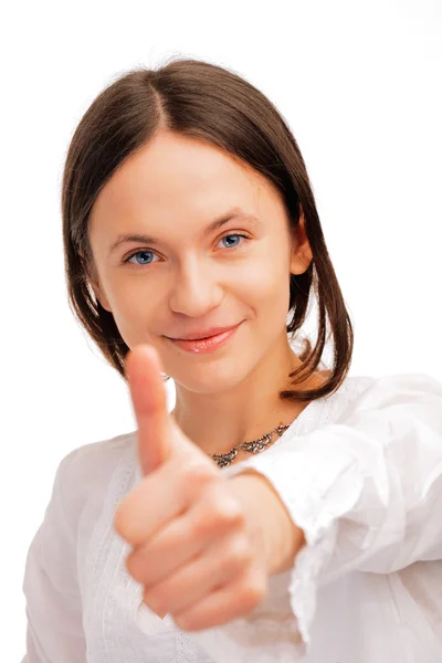 Mladá žena ukazuje palec nahoru — Stock fotografie
