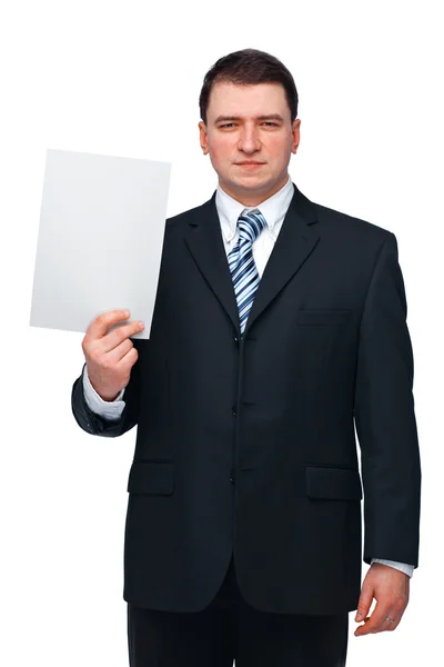 Бизнесмен, держащий бланковую бумагу — стоковое фото