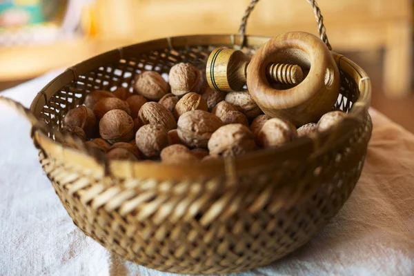 Bowl of mixed walnuts with nutcracker — Stock Photo, Image