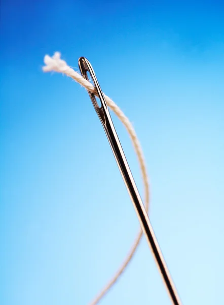 Needle with a thread — Stock Photo, Image
