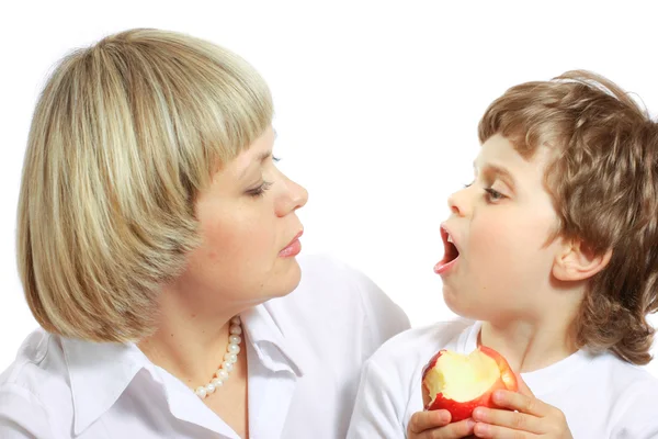 stock image Woman and boy eating apple