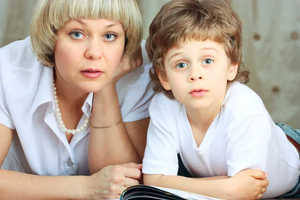 Woman and little boy reading book — Stock Photo, Image