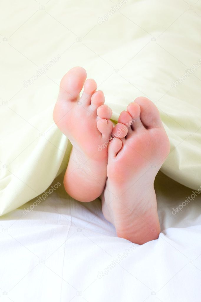 Feet under blanket