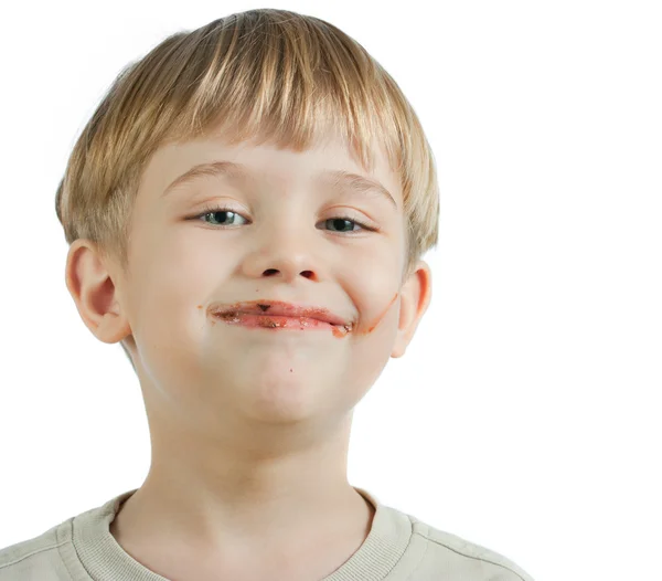 Ładny chłopiec czekolada twarzy — Zdjęcie stockowe