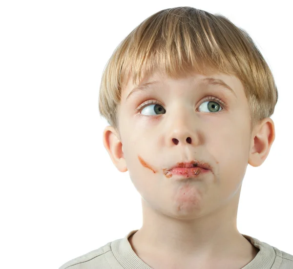 Söt pojke med choklad ansikte — Stockfoto