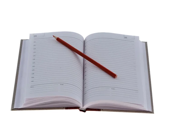 stock image Notebook with red pencil