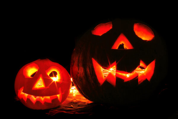 Pumkins with ligths in dark halloween symbol