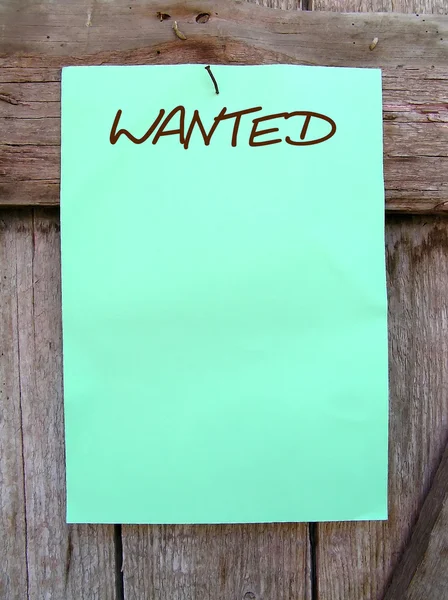 stock image Wanted poster on a wooden wall.