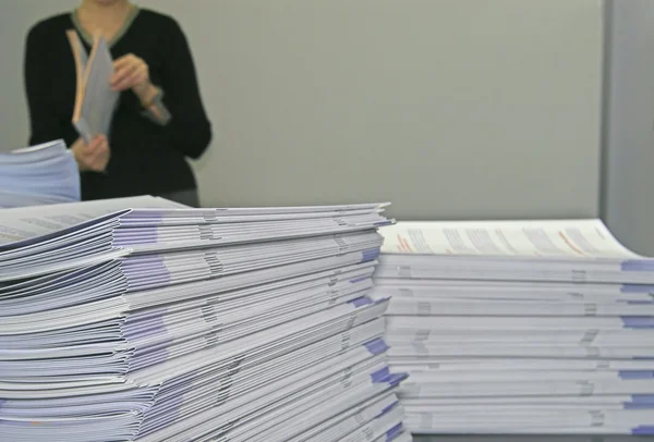 Piles of handout papers — Stock Photo, Image