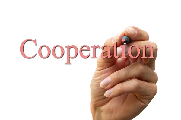 Hand writing the word cooperation — Stock Photo, Image