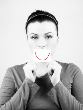 Sad woman with fake smile. clipart
