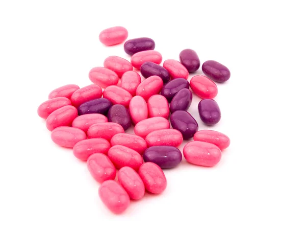 Рожеві та фіолетові цукерки — стокове фото