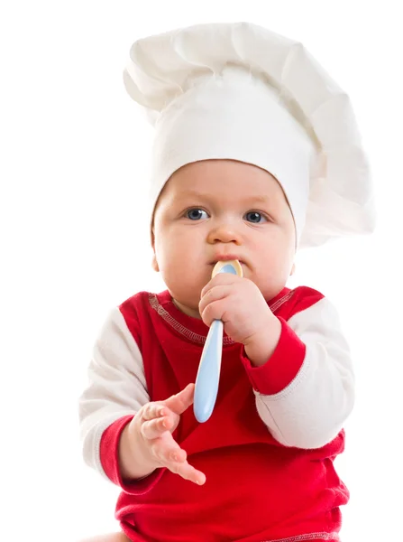 Ребенок в шляпе повара — стоковое фото