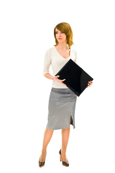 ノート パソコンで立っている女性実業家 ストック写真