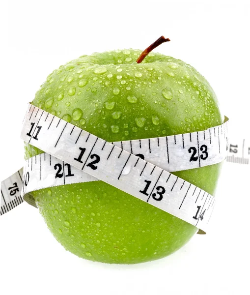 Grüner Apfel misst das Messgerät — Stockfoto