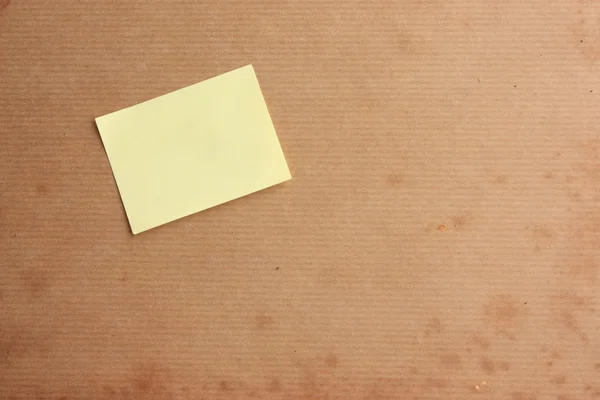 Aged background with post it note — Stock Photo, Image