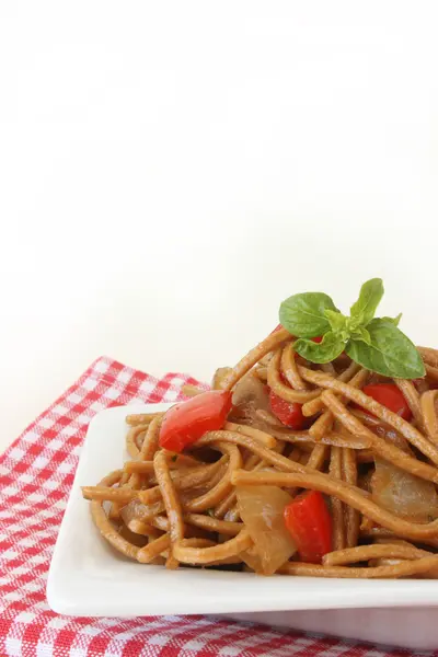 stock image Fried noodles with vegetables and basil