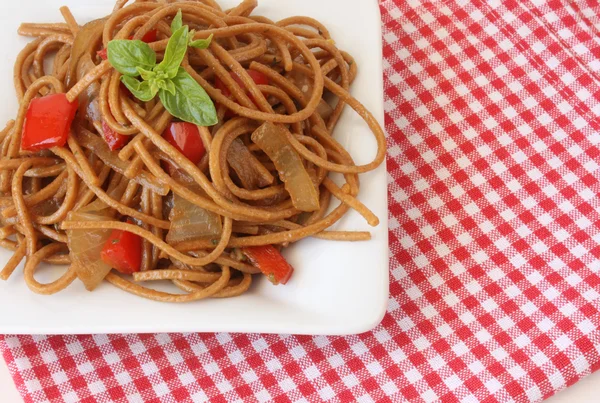 stock image Pasta with vegetables and basil