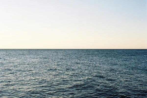 海の上の夕日 ロイヤリティフリーのストック画像