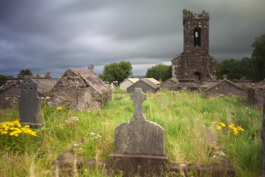 Irish graveyard cemetary dark clouds clipart