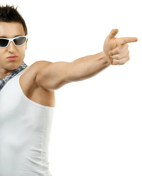 Muscular young man shoots finger — Stock Photo, Image