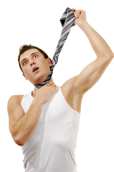 Muscular man hangs himself in a tie — Stock Photo, Image