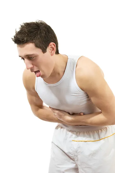 Νεαρός άνδρας με πόνο στο στομάχι. απομονωθεί σε λευκό φόντο Φωτογραφία Αρχείου