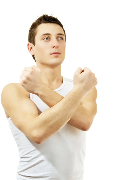 Jeune homme gesticulant symbole de combat. Isolé sur blanc Photo De Stock