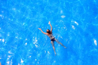 Blue water and girl.