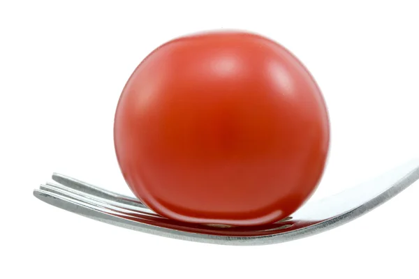 Pomidor i widelec. — Zdjęcie stockowe