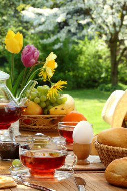 Breakfast in the garden. clipart