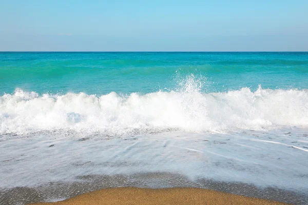 stock image Sky, sea, waves and sandy beach.