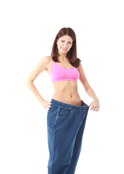 Женщина показывает, как сильно она похудела — стоковое фото