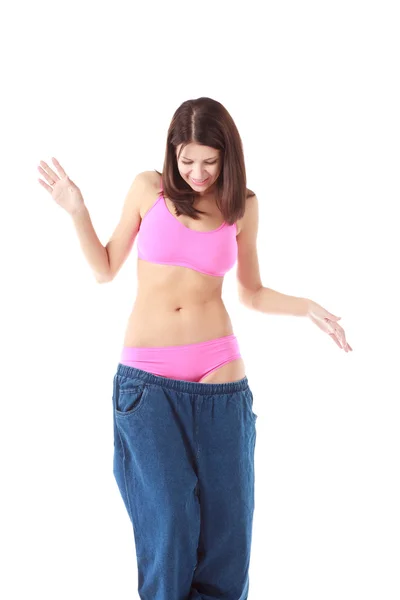 どれだけ体重を落としたかを示す女 — ストック写真