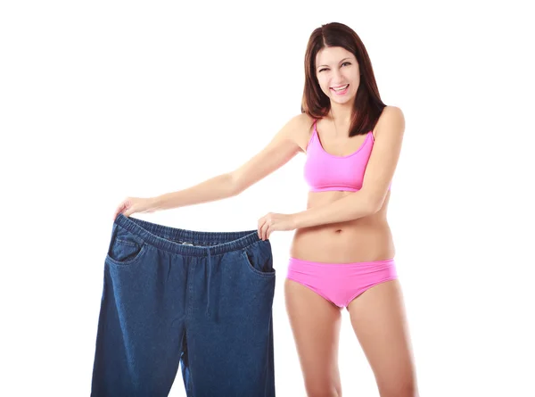 Žena ukazující, jak moc zhubla — Stock fotografie