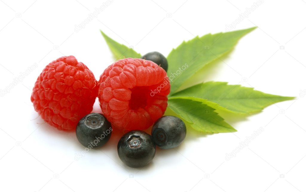 Isolated raspberry and blueberry